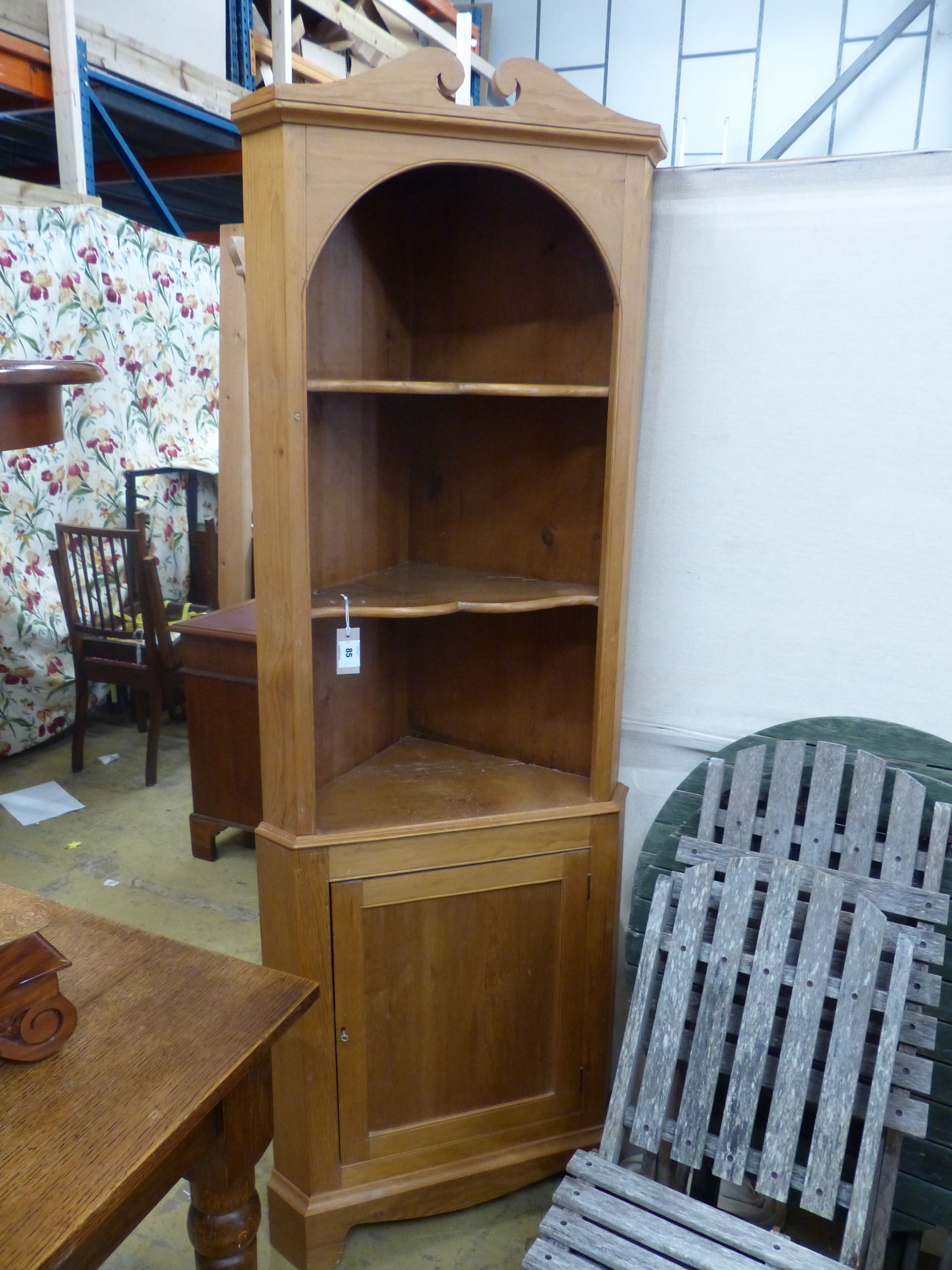 A pine standing corner cabinet, height 180cm
